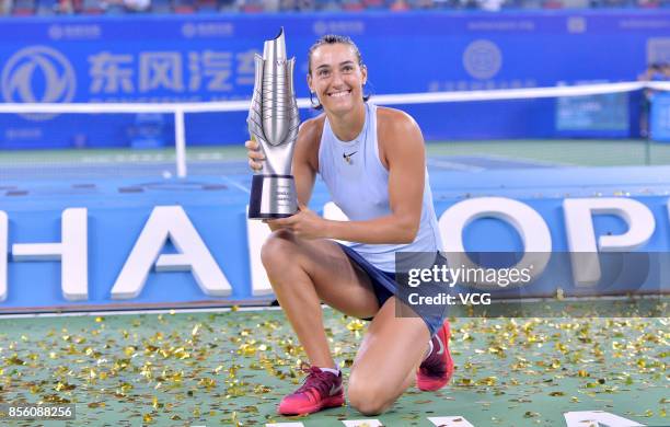 Caroline Garcia of France poses with her trophy after winning the ladies singles final against Ashleigh Barty of Australia on Day 7 of 2017 Dongfeng...