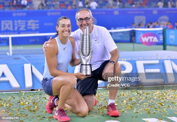 Caroline Garcia of France poses with her trophy after winning the ladies singles final against Ashleigh Barty of Australia on Day 7 of 2017 Dongfeng...