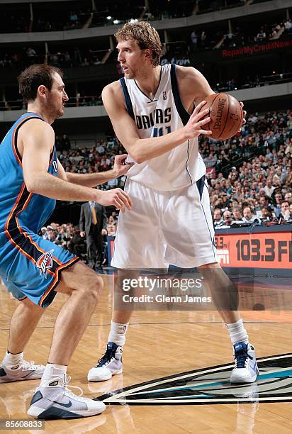 Dirk Nowitzki of the Dallas Mavericks moves the ball against Nenad Krstic of the Oklahoma City Thunder during the game on February 27, 2009 at...