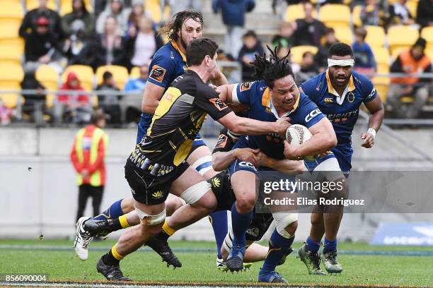 Aki Seiuli of Otago looks to break free from a tackle from Will Mangos of Wellington during the round seven Mitre 10 Cup match between Wellington and...