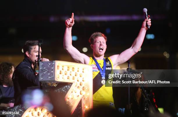Jack Riewoldt of the Tigers sings on stage with Brandon Flowers and The Killers during the Virgin Australia Premiership Party after the 2017 AFL...