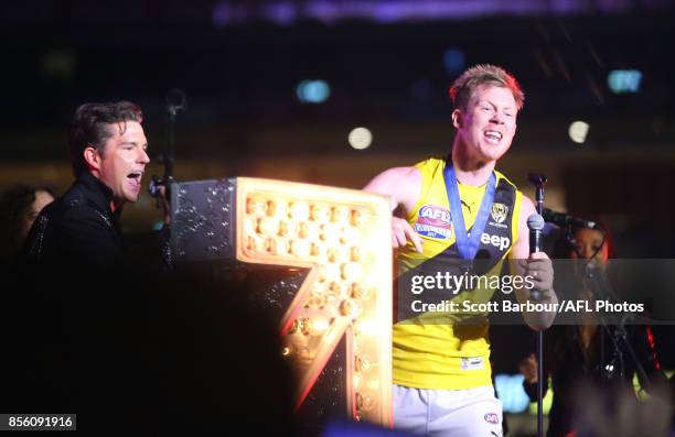 Jack Riewoldt of the Tigers sings on stage with Brandon Flowers and The Killers during the Virgin Australia Premiership Party after the 2017 AFL...