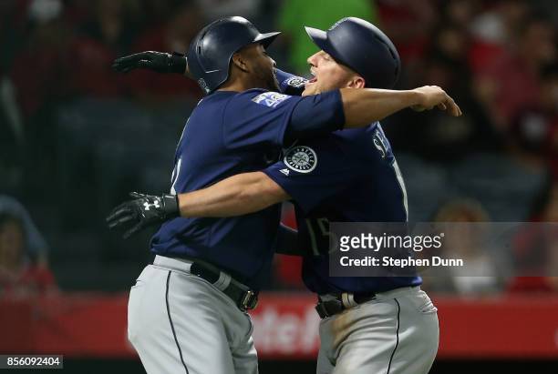 Kyle Seager and Nelson Cruz of the Seattle Mariners celebrate after both score on Seager's three run home run in the eighth inning to give the...