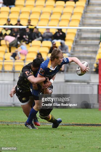 Hayden Parker of Otago offloads the ball during the round seven Mitre 10 Cup match between Wellington and Otago on October 1, 2017 in Wellington, New...