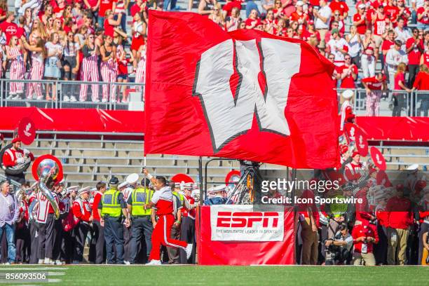 Cheerleader celebrates a Wisconsin touchdown during the Big Ten football season opener between the University of Wisconsin Badgers and the...