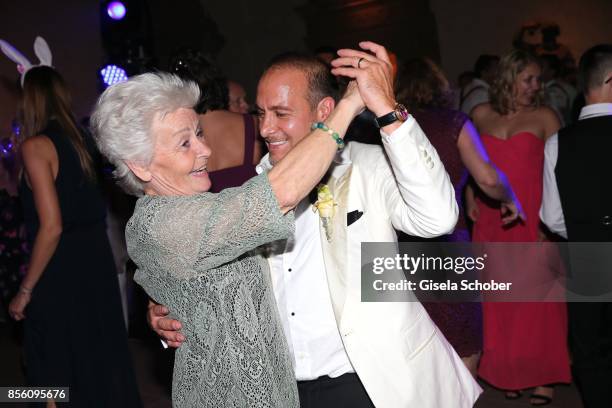 Erdogan Atalay dance with his mother Baerbel Atalay during the church wedding of Erdogan Atalay and Katja Ohneck at Heidelberg Castle on September...