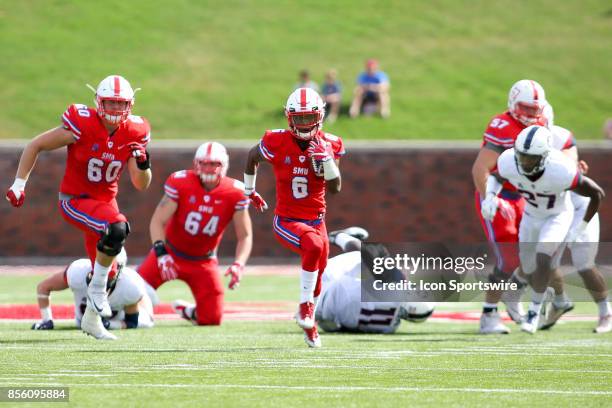 Mustangs running back Braeden West rushes down the field during a football game against the Connecticut Huskies on September 30, 2017 at Gerald J....