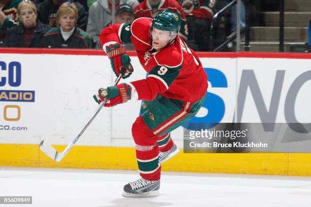Mikko Koivu of the Minnesota Wild passes the puck against the Edmonton Oilers during the game at the Xcel Energy Center on March 22, 2009 in Saint...