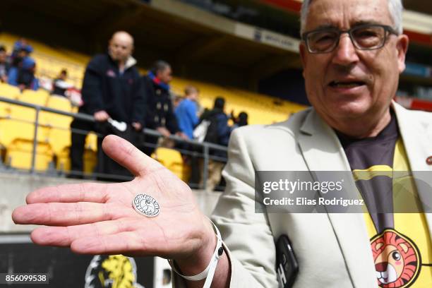 Bill Day chairman of Wellington Childrens Hospital with the coin used in the coin toss to be put up for auction for charity during the round seven...