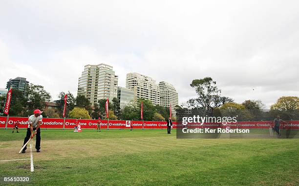 Lewis Hamilton of Great Britain and McLaren Mercedes faces a delivery from Australian cricket legend Shane Warne in a 'backyard' cricket match in...