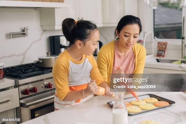 mother and daughter at home - filipino family stock pictures, royalty-free photos & images