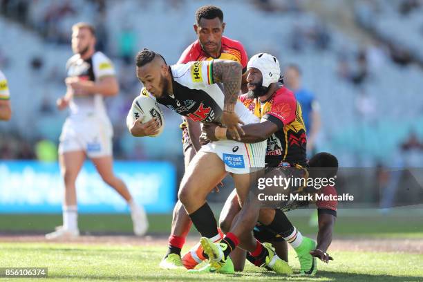 Tony Satini of the Panthers is tackled during the 2017 State Championship Final between the Penrith Panthers and Papua New Guinea Hunters at ANZ...