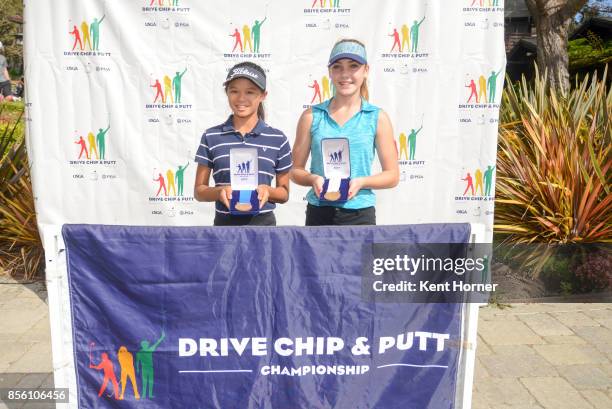 First and third place chipping skills for girls age 12-13 category Arin Chian, left, and Sophia Spiva pose with their medals during a regional round...