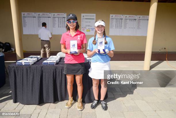 First and third place putting skills for girls age 12-13 category Catherine Rao, left, and Victoria Romney pose with their medals during a regional...