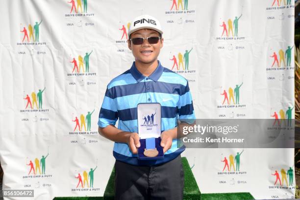 First place chipping boys 12-13 Anawin Pikulthong poses during a regional round of the Drive, Chip and Putt Championship at Torrey Pines Golf Course...