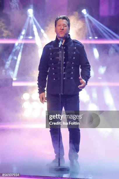 Claudius Dreilich, singer of the band Karat performs with Rock Legenden during the tv show 'Willkommen bei Carmen Nebel' at TUI Arena on September...