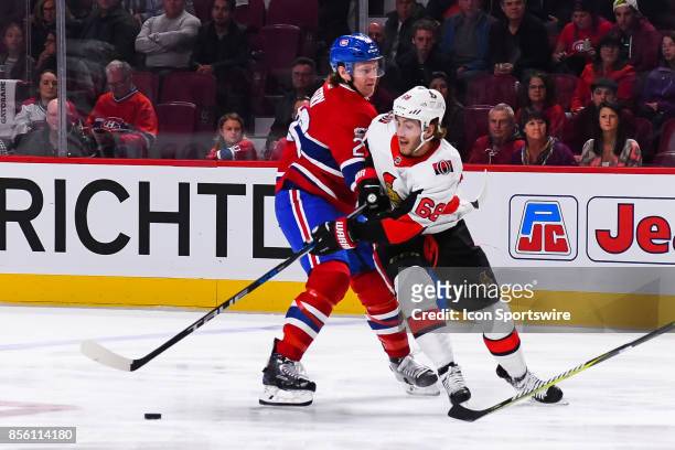 Ottawa Senators left wing Mike Hoffman tries to reach the puck while Montreal Canadiens defenseman Jeff Petry blocks him during the Ottawa Senators...