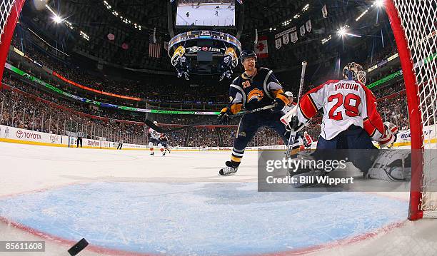 Jason Pominville of the Buffalo Sabres scores a third period goal past Tomas Vokoun of the Florida Panthers on March 25, 2009 at HSBC Arena in...