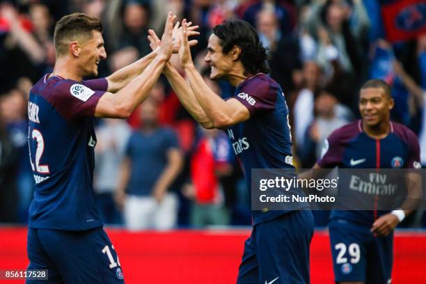Paris Saint-Germain's Uruguayan forward Edinson Cavani and Paris Saint-Germain's Belgian defender Thomas Meunier celebrate after scoring during the...