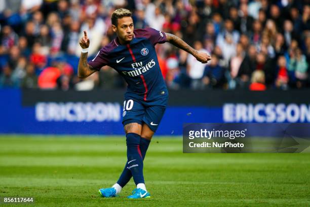 Paris Saint-Germain's Brazilian forward Neymar shoots to score a free kick during the French L1 football match between Paris Saint-Germain and...