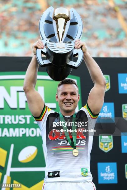 Darren Nicholls of the Panthers holds aloft the trophy after winning the 2017 State Championship Final between the Penrith Panthers and Papua New...