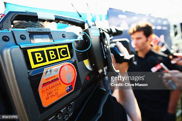 Mark Webber of Australia and Red Bull Racing is interviewed by the BBC in the paddock during previews to the Australian Formula One Grand Prix at the...
