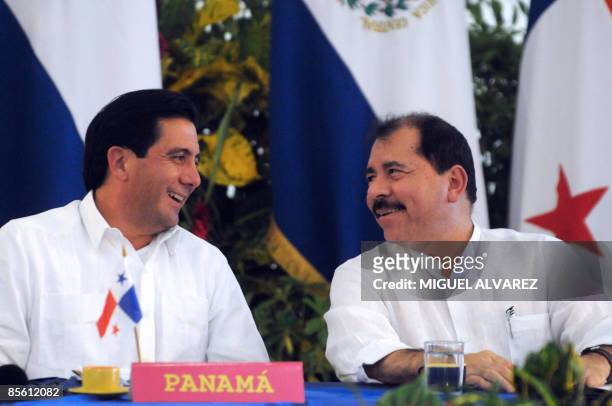 Nicaragua's President Daniel Ortega talks with his Panamanian counterpart Omar Torrijos during a press conference after the Central-American...