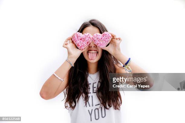 girl with heart shape  donuts in front of her eyes and ice cone on head - sugar pile stock pictures, royalty-free photos & images