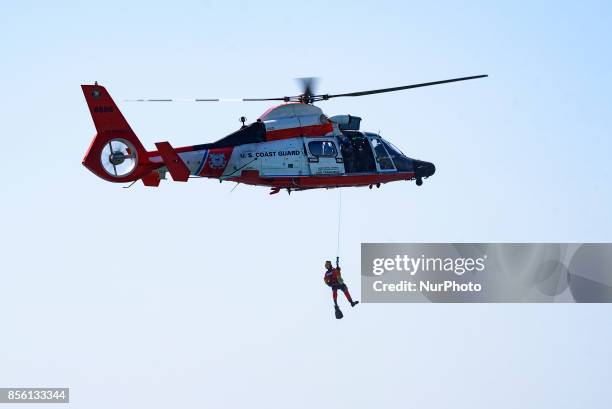 Coast Guard team during a search and rescue demonstration at the Breitling Airshow in Huntington Beach, California on September 30, 2017. The...
