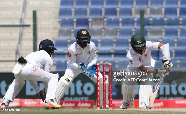 Yasir Shah of Pakistan plays a shot during the fourth day of the first Test cricket match between Sri Lanka and Pakistan at Sheikh Zayed Stadium in...