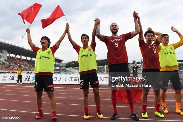 Players of Nagoya Grampus celebrate the win after the J.League J2 match between FC GIfu and Nagoya Grampus at Nagaragawa Stadium on October 1, 2017...