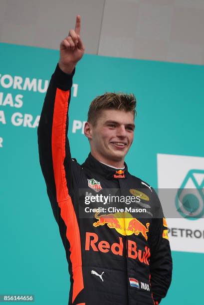 Race winner Max Verstappen of Netherlands and Red Bull Racing celebrates on the podium during the Malaysia Formula One Grand Prix at Sepang Circuit...