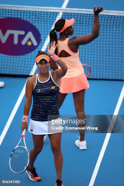 Sloane Stephens of USA and Heather Watson of Great Britain celebrate after their match against Anastasija Sevastova of Latvia and Donna Vekic of...