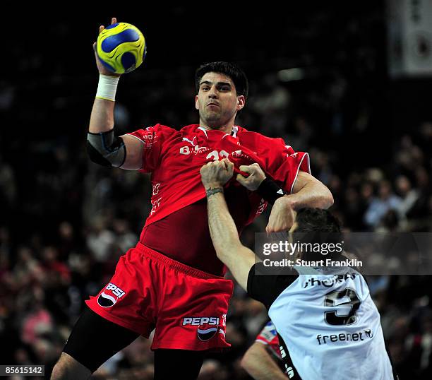 Nenad Vuckovic of Melsungen is challenged by Igor Anic of Kiel during the Toyota Handball Bundesliga match between THW Kiel and MT Melsungen at the...