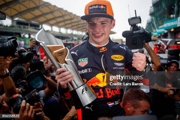 Race winner Max Verstappen of Netherlands and Red Bull Racing celebrates with his team during the Malaysia Formula One Grand Prix at Sepang Circuit...