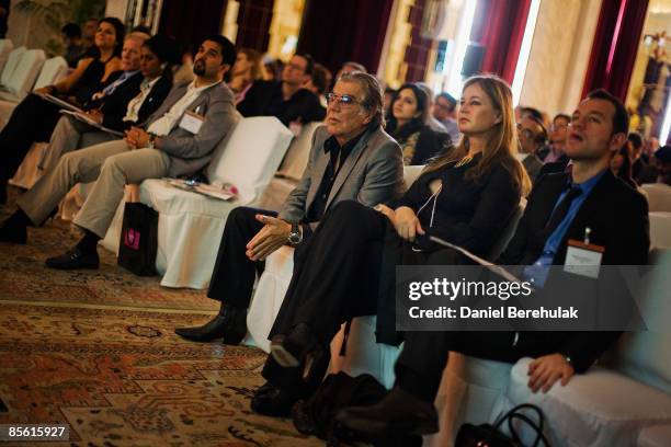 Fashion designer Roberto Cavalli and wife Eva Cavalli look on during the International Herald Tribune Sustainable Luxury 2009 conference on March 26,...