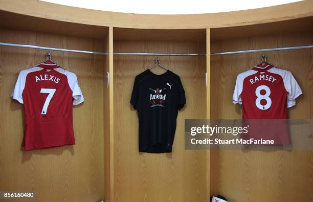 Alexis Sanchez and Aaron Ramsey shirts hang in the Arsenal changing room before the Premier League match between Arsenal and Brighton and Hove Albion...