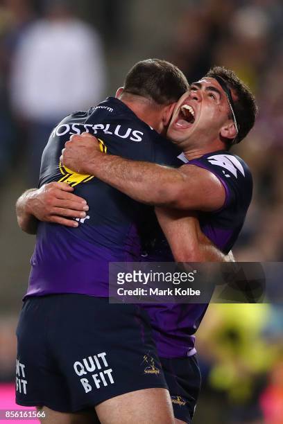 Dale Finucane of the Storm celebrates with Cameron Smith of the Storm after scoring a try during the 2017 NRL Grand Final match between the Melbourne...