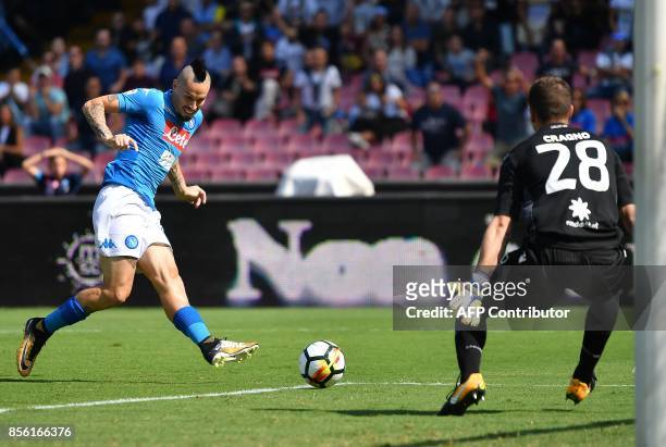 Napoli's Slovakian midfielder Marek Hamsik scores during the Italian Serie A football match Napoli vs Cagliari on October 1, 2017 at San Paolo...