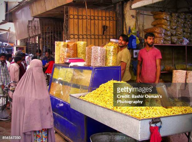 streets of karachi - burqa for sale stock pictures, royalty-free photos & images