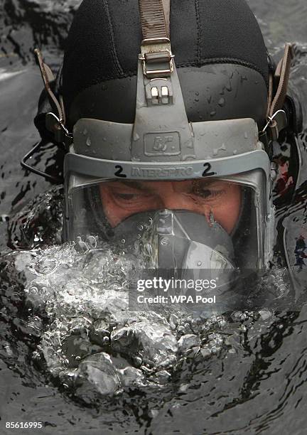 Metropolitan Police diving team carry out a security search of the Royal Victoria Dock ahead of next week's G20 summit at the nearby Excel Centre on...