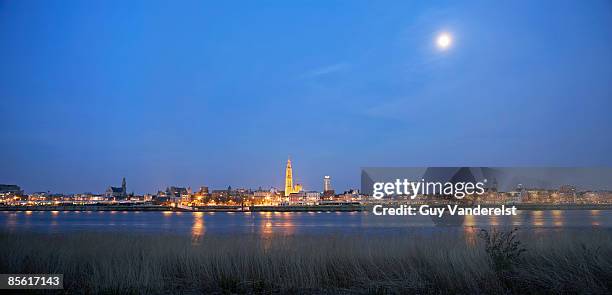 skyline of antwerp over river scheldt  - scheldt river stockfoto's en -beelden