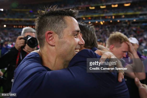 Cooper Cronk of the Storm celebrates with coach Craig Bellamy after winning the 2017 NRL Grand Final match between the Melbourne Storm and the North...