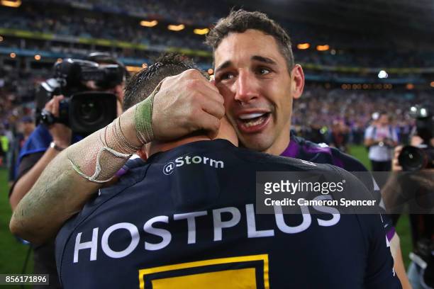 Cooper Cronk of the Storm celebrates with Billy Slater of the Storm after winning the 2017 NRL Grand Final match between the Melbourne Storm and the...