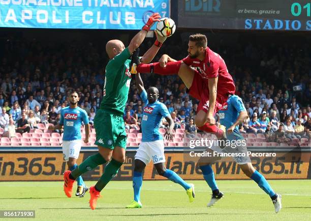 Player of SSC Napoli Pepe Reina vies with Cagliari Calcio player Leonardo Pavoletti during the Serie A match between SSC Napoli and Cagliari Calcio...