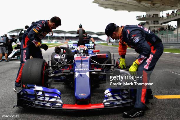 Pierre Gasly of France and Scuderia Toro Rosso prepares to drive on the grid before the Malaysia Formula One Grand Prix at Sepang Circuit on October...