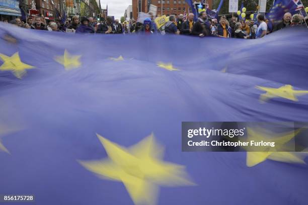 Anti-Brexit and anti-austerity activists take part in protests as the Conservative party annual conference gets underway at Manchester Central on...