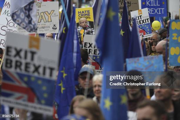 Anti-Brexit and anti-austerity activists take part in protests as the Conservative party annual conference gets underway at Manchester Central on...