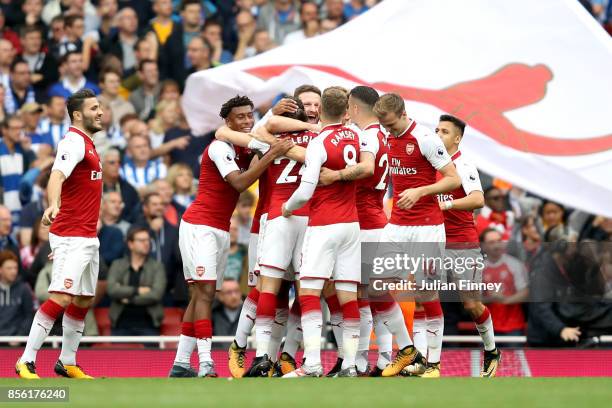 Nacho Monreal of Arsenal celebrates scoring his sides first goal with his Arsenal team mates during the Premier League match between Arsenal and...