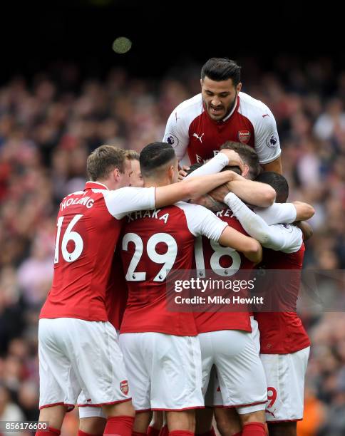 Nacho Monreal of Arsenal celebrates scoring his sides first goal with his Arsenal team mates during the Premier League match between Arsenal and...